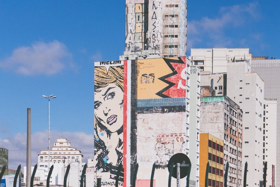 Street art on a high-rise in São Paulo showcasing colorful urban graffiti and architecture.