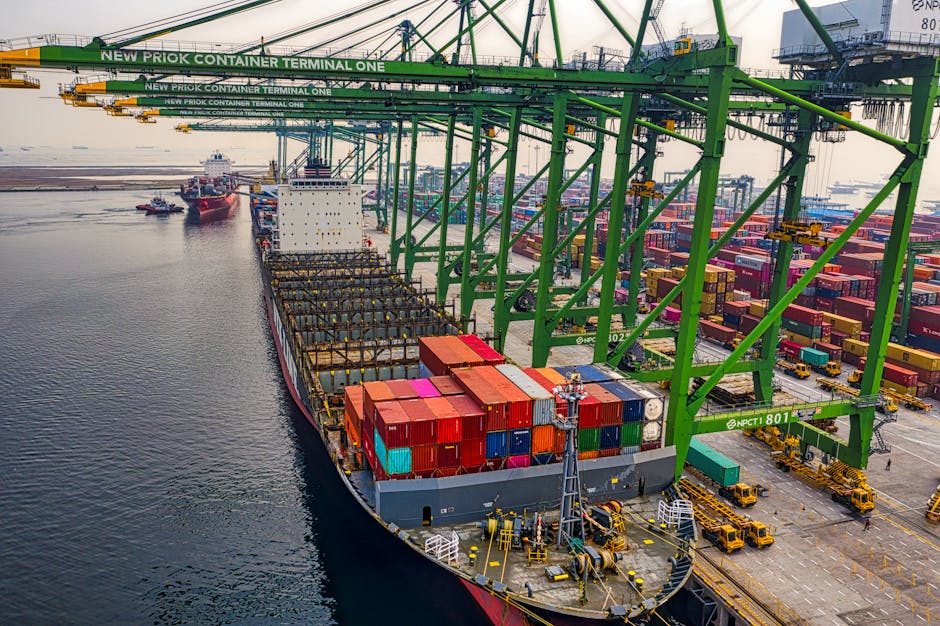 Container ship loading at New Priok Container Terminal in North Jakarta, showcasing the bustling industrial port.