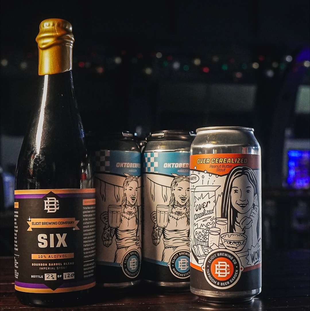 an image of Elicit Brewing stout bottles and cans displayed on a bar top.