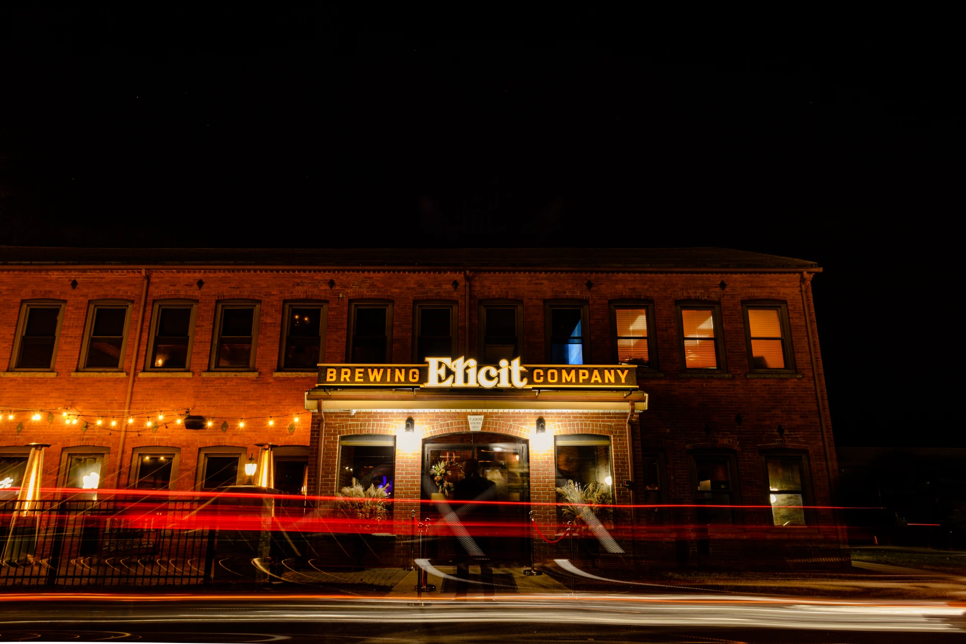 An image of Elicit Brewing Company’s Manchester outlet at Night.  