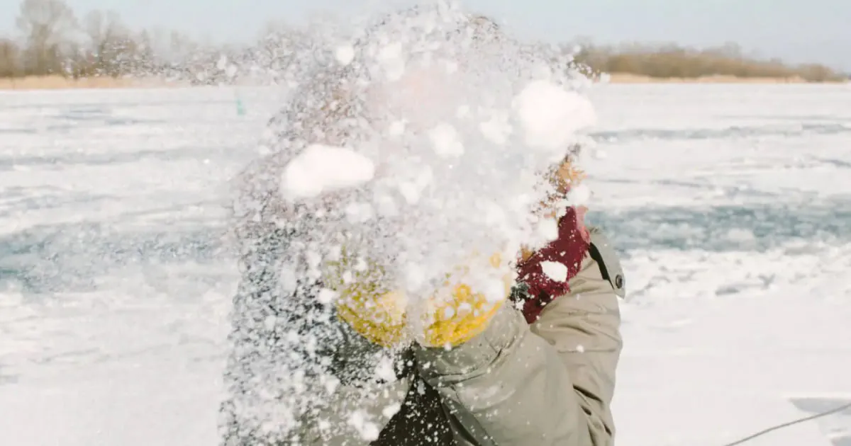Someone throwing a pile of snow edited on VSCO app