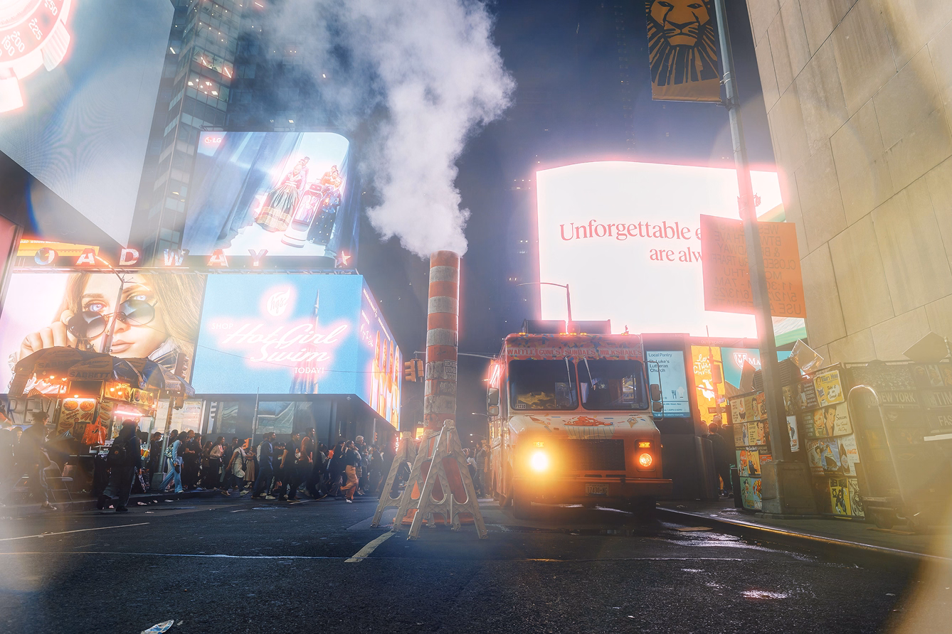 Photo of a busy city street edited with a lens flare overlay