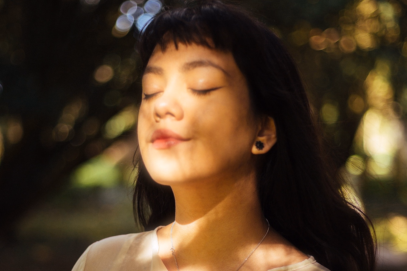 Close portrait of a woman with dreamy bloom effect