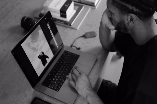 Photographer Nate King editing a photo on a laptop