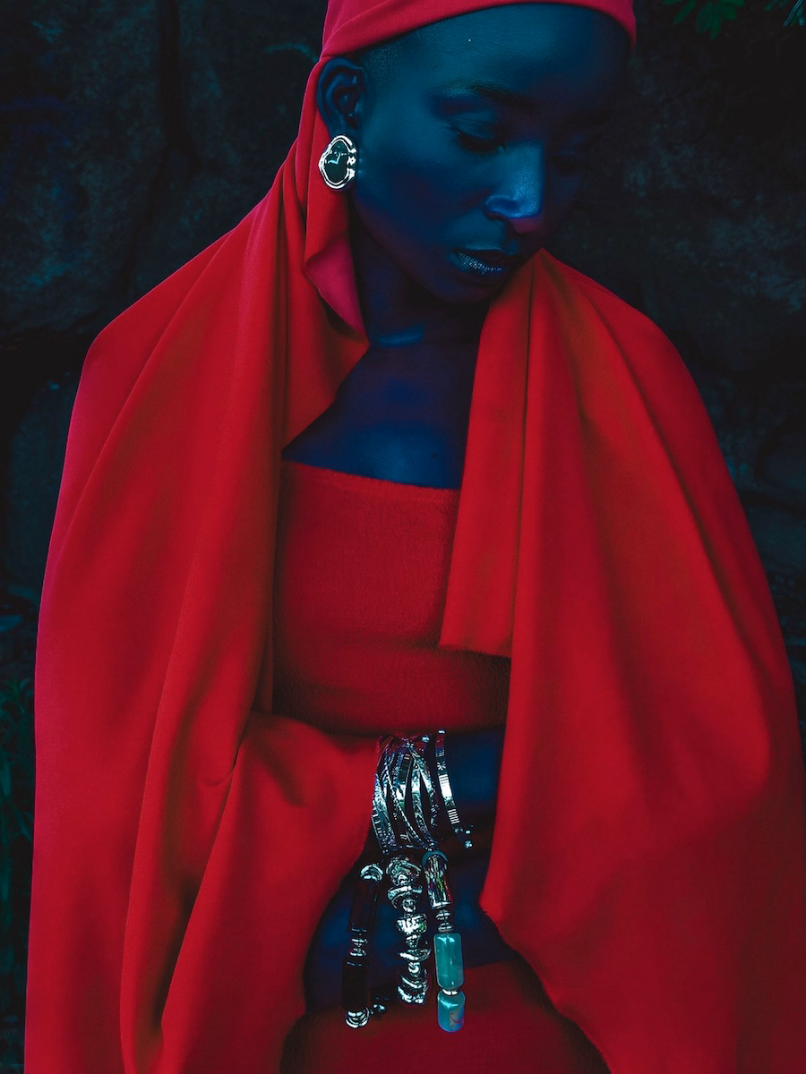 Portrait photo of a woman in a red dress by photographer John Baloy