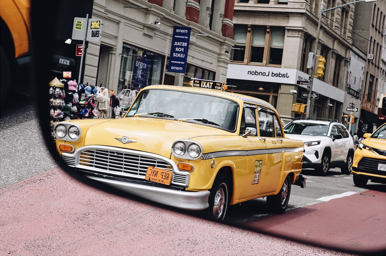 Vintage taxi in a rearview mirror edited with recipe by Greg Schmigel