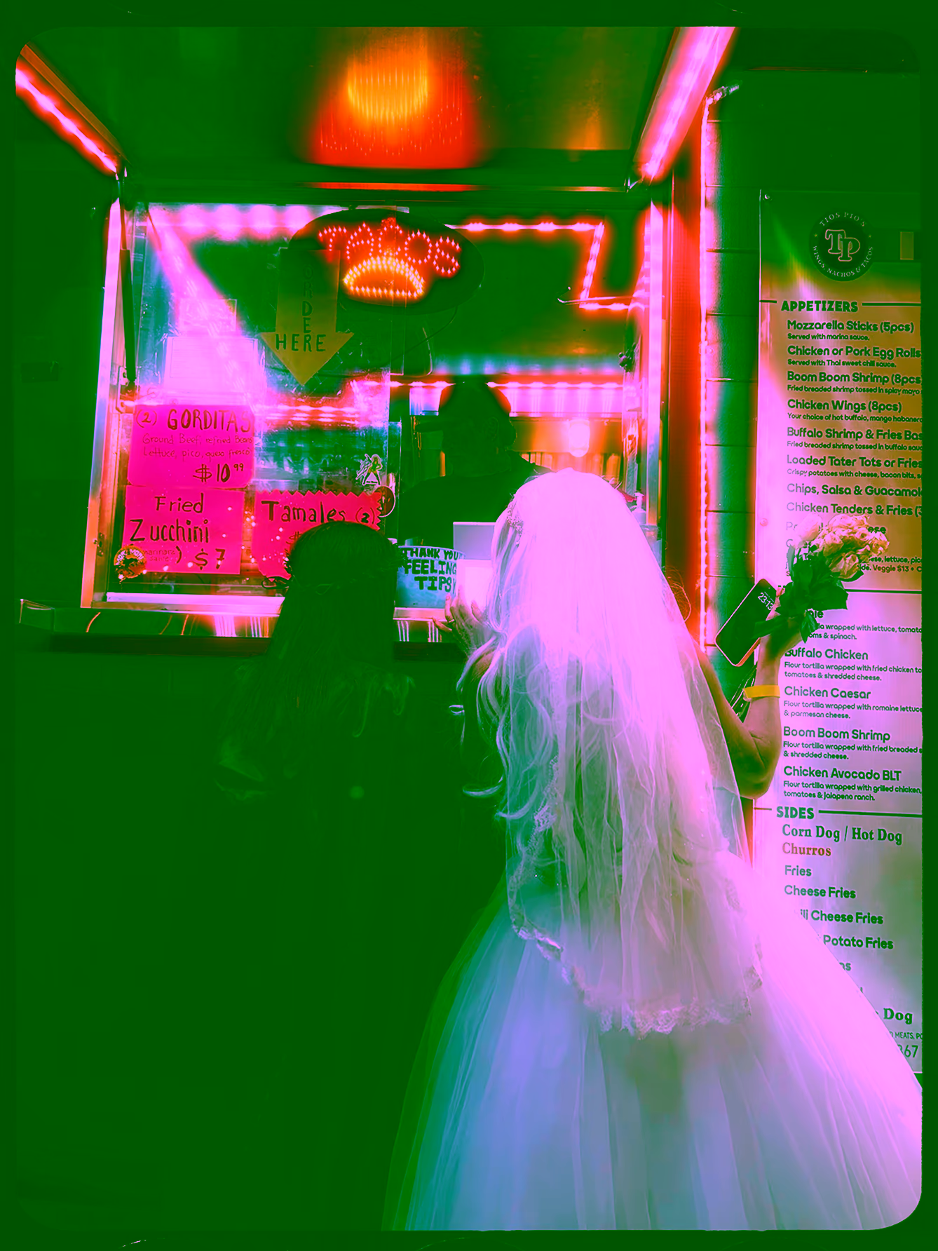 Bride ordering from a taco window taken by photographer Andrea Landa Cruz