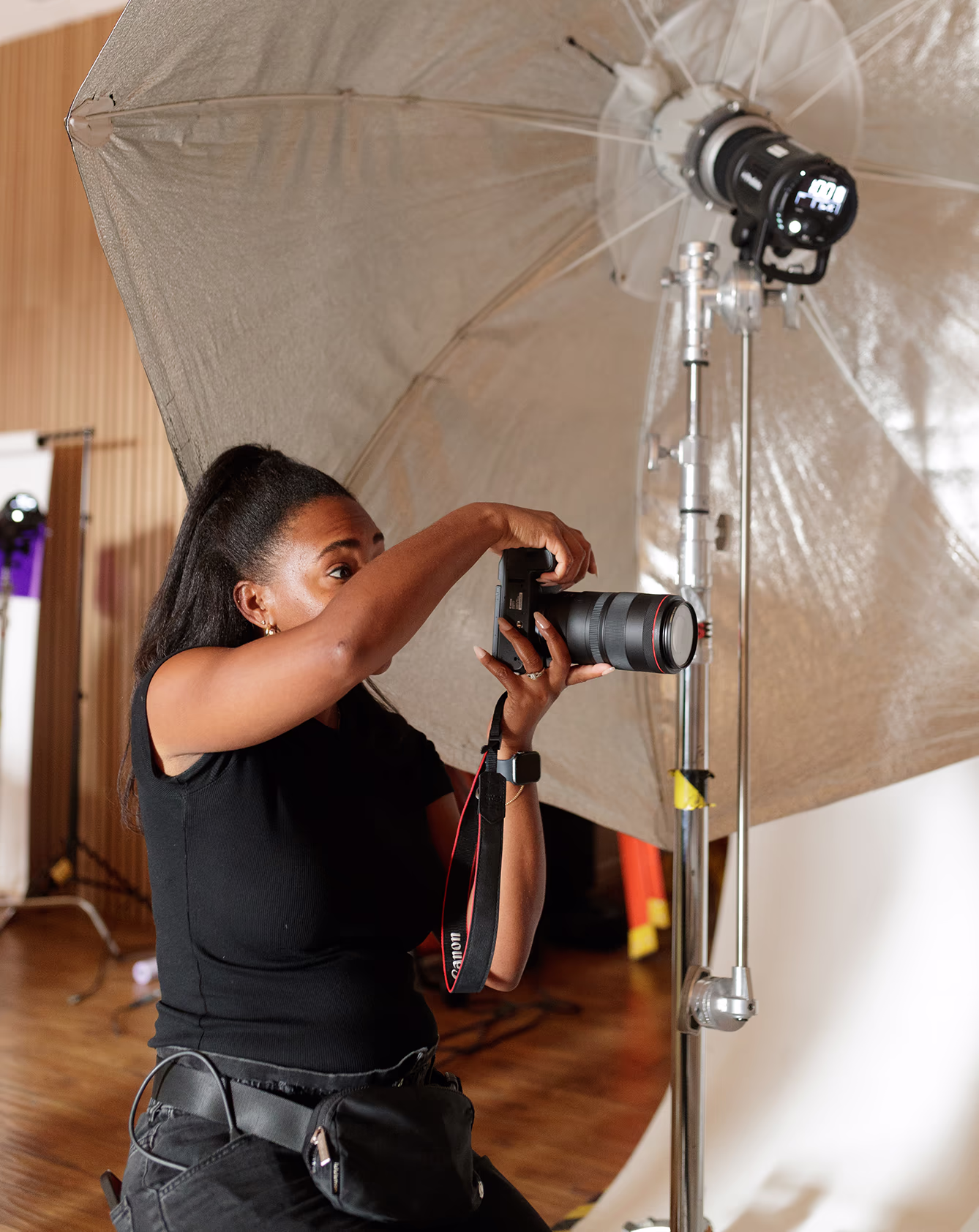 Photographer holding a camera on photoshoot set