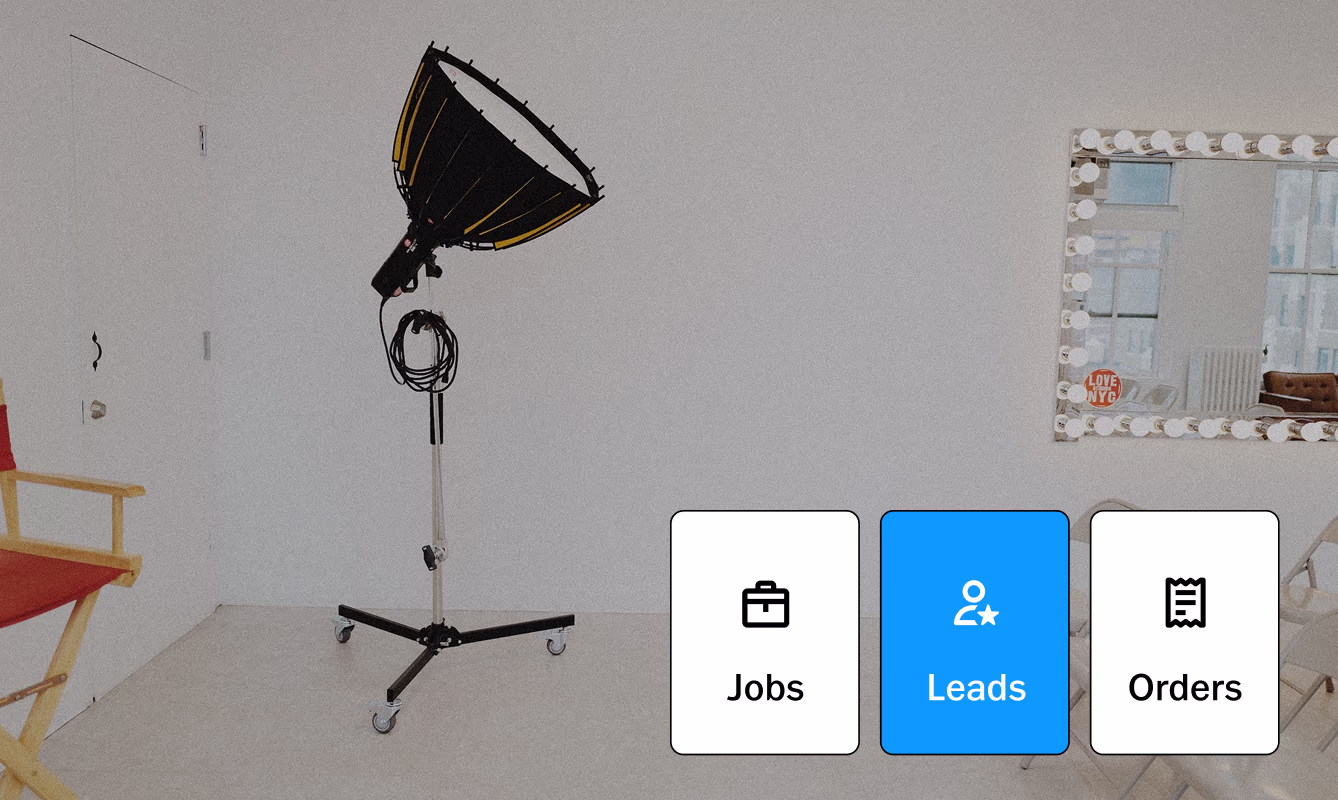 Leads, Jobs, and Orders studio management tools UI overlaid on photoshoot set