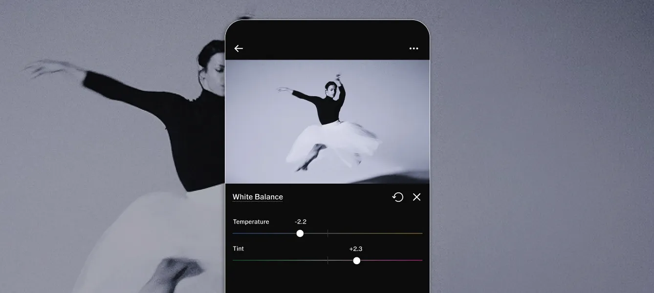 VSCO Studio Pro mobile UI showing White Balance editor on an image of a ballerina with Temperature slider at -2.2 and Tint slider at +2.3