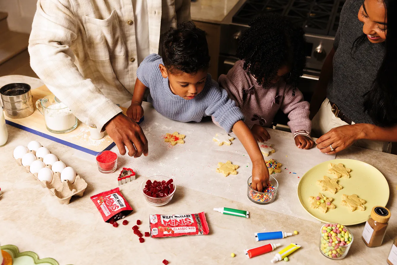 Commercial photography of family in the kitchen decorating cookies