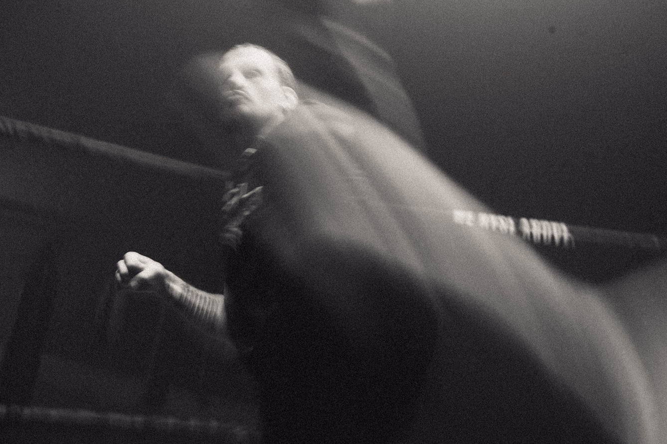 Black and white professional photo of a boxer in motion for a fitness industry client
