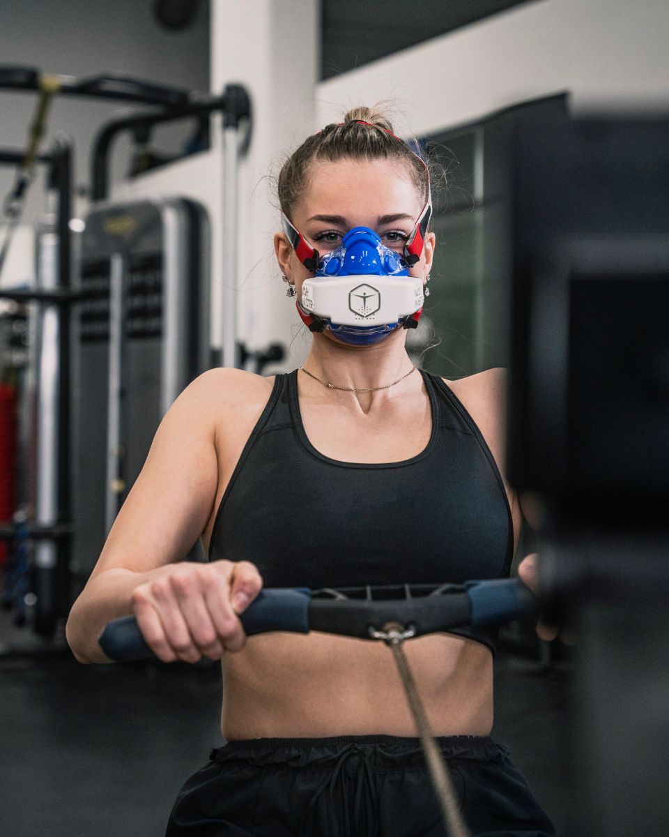 Woman rowing wearing vo2 master analyzer