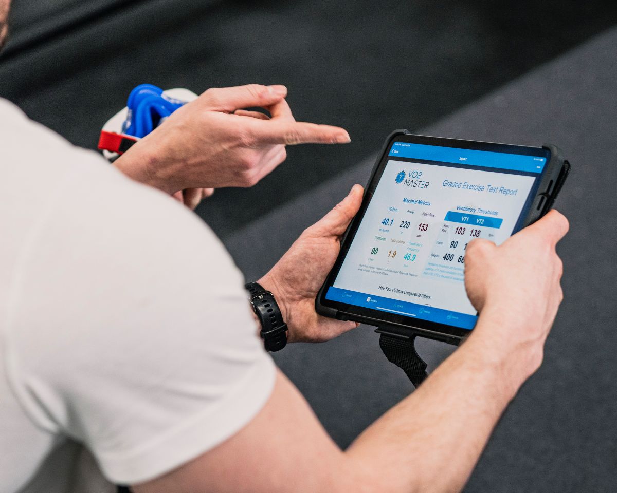 Physical therapist reviewing Vo2 results dashboard