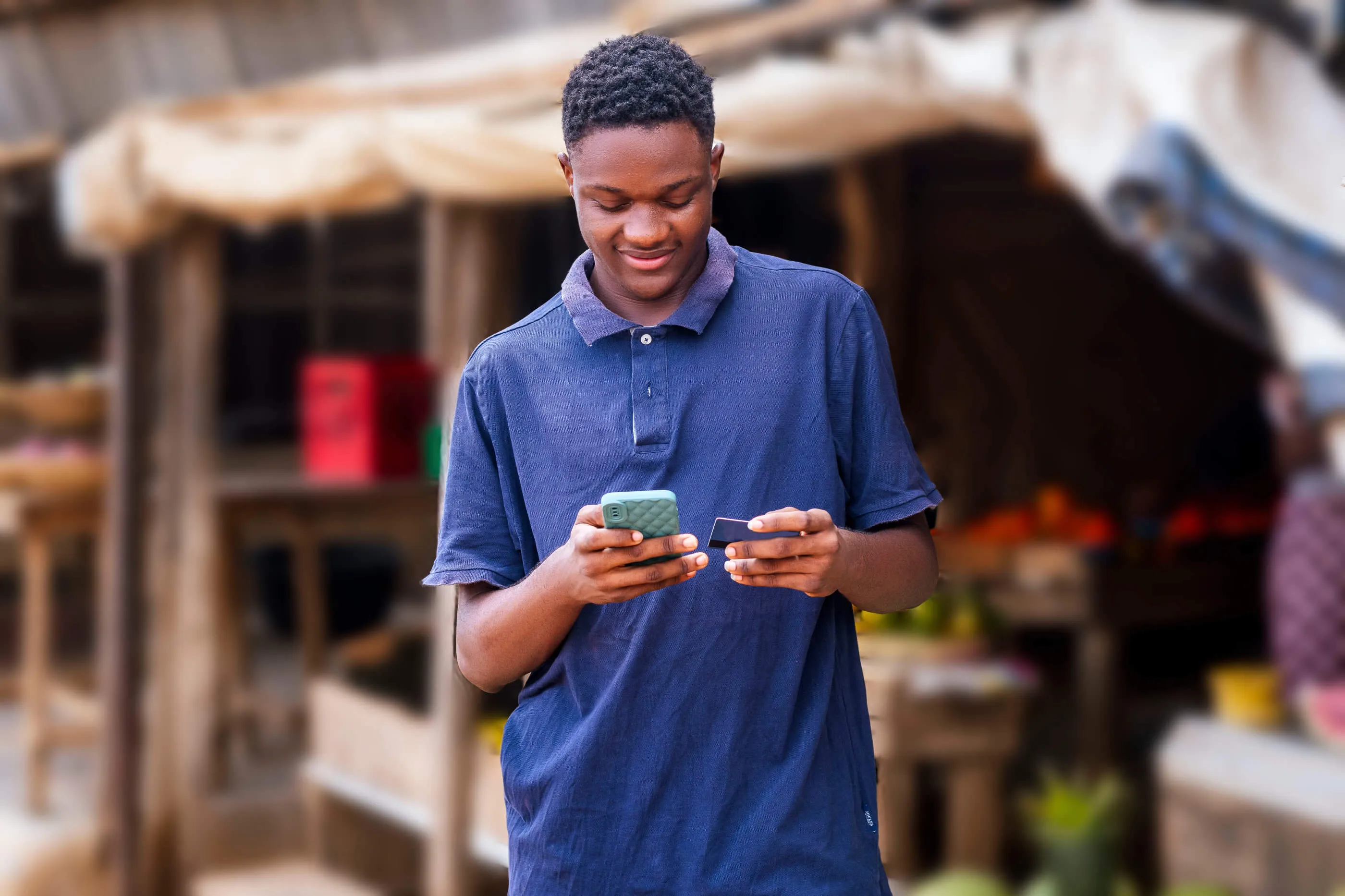 Happy customer using phone to process payment