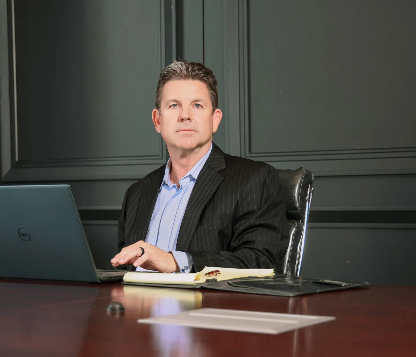 Eric Kern at his desk with laptop and notes, reflecting a rich heritage and personal journey