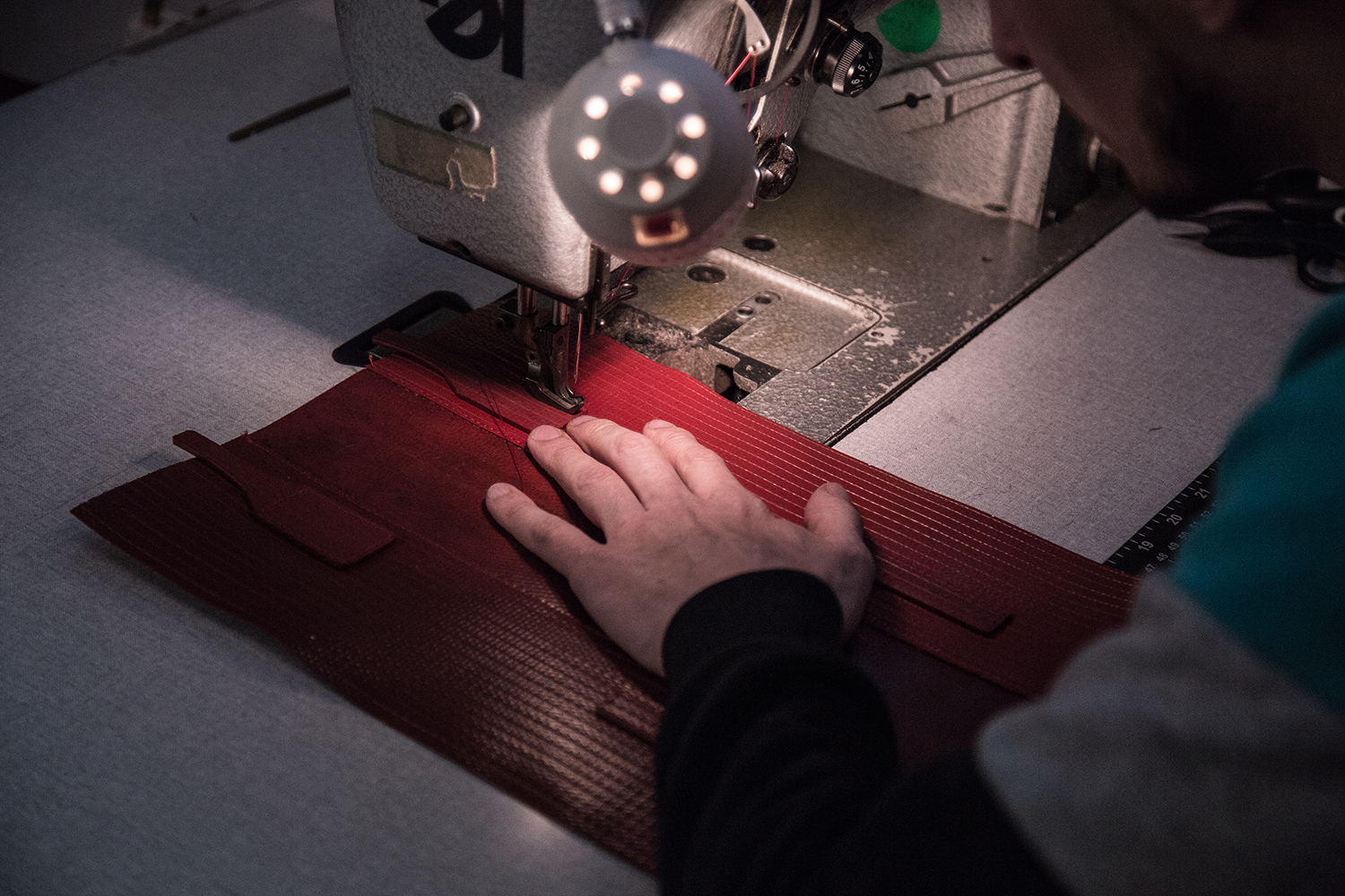 Elvis & Kresse team working on the sewing machine