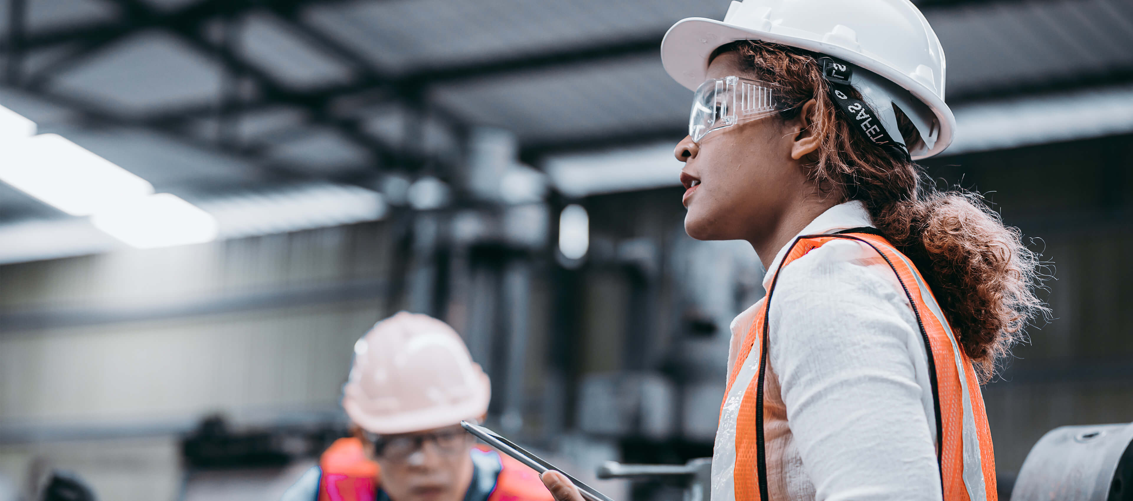 woman in a jobsite with tablet.
