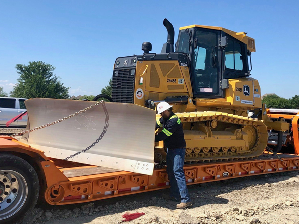 bull dozer being moved.