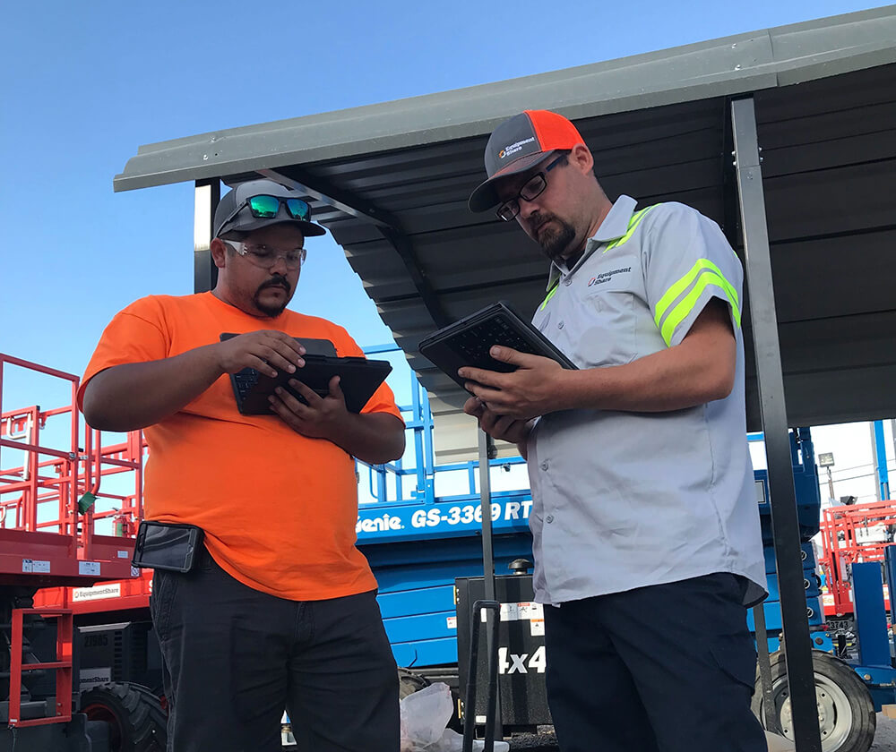 men working on tablets.