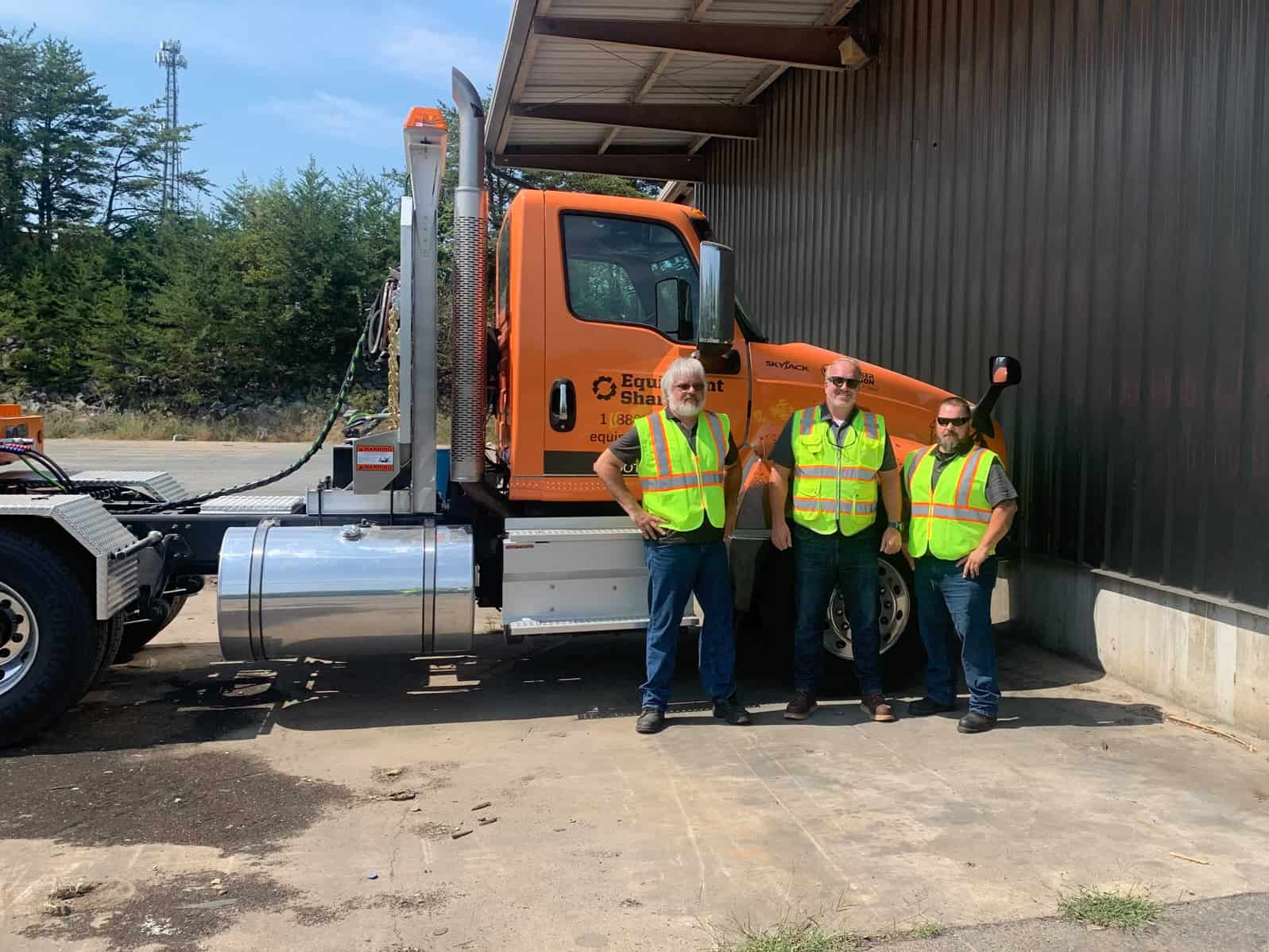 People with EquipmentShare truck.