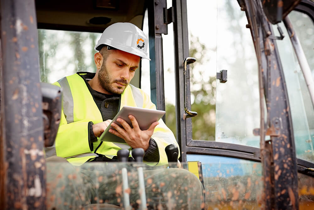 Man workin on tablet.