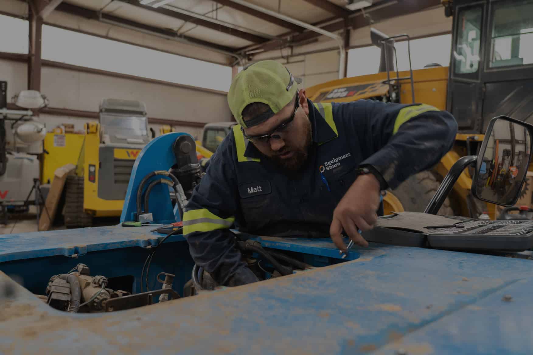 Man servicing a machine.