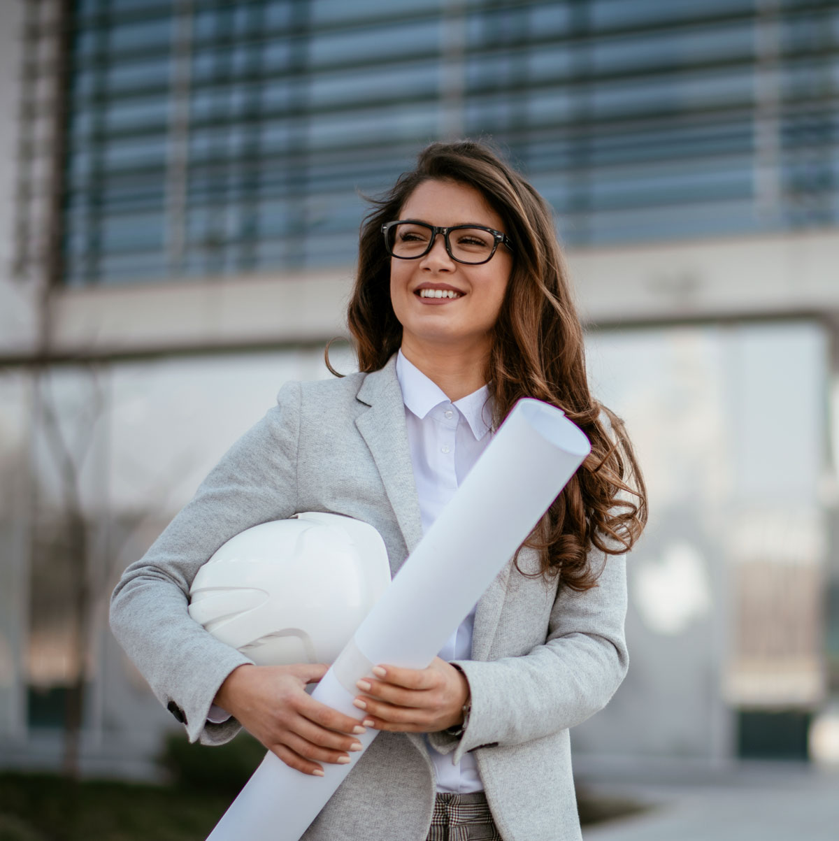 realtor standing in front of a building.
