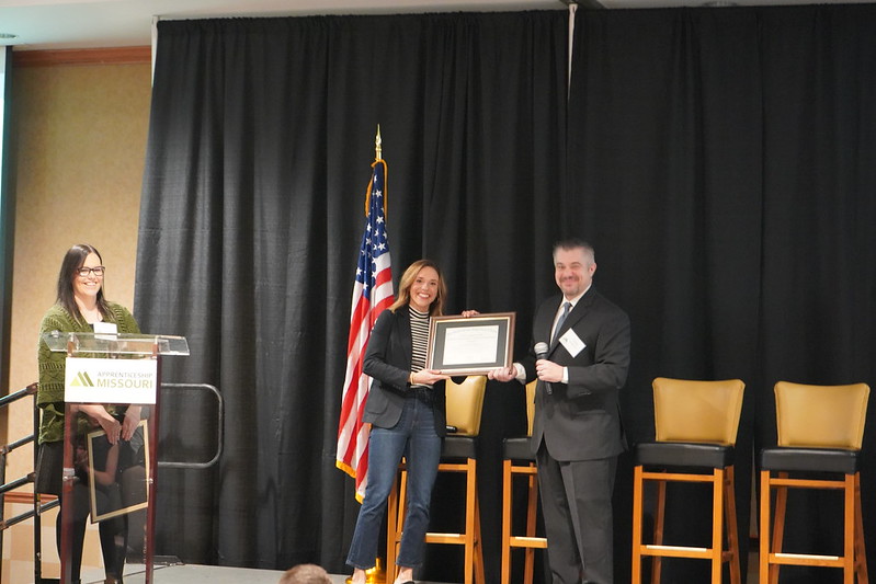 Image of person receiving a certificate.