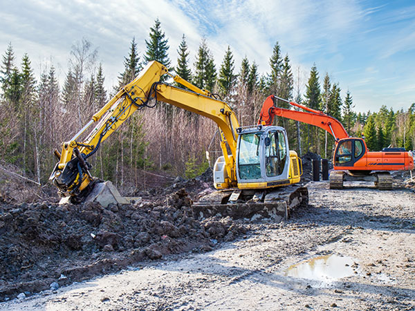 midi excavator digging dirt at a jobsite