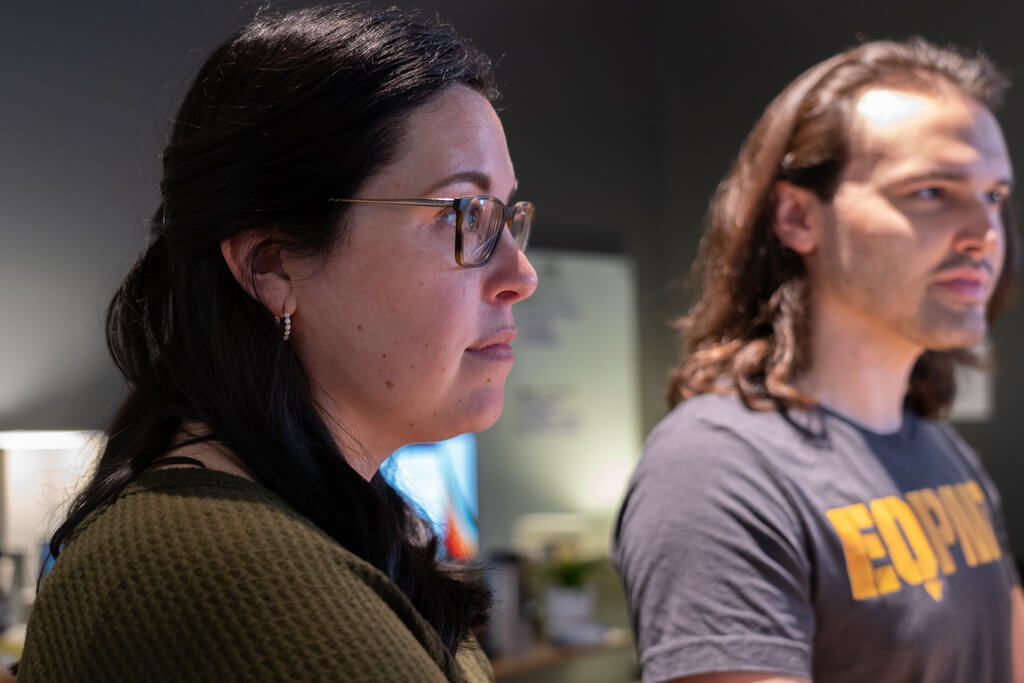 Two EquipmentShare employees looking at something out of frame