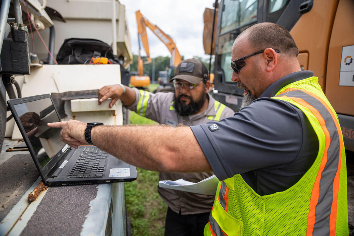 Mechanic working on heavy equipment.