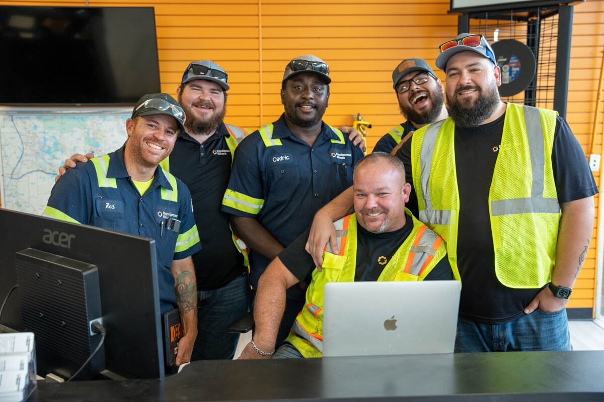 Group of EquipmentShare employees smiling.