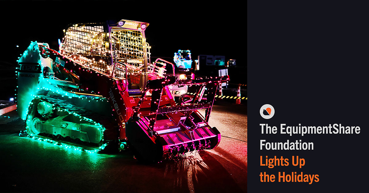 Dirt digger covered in colorful christmas lights