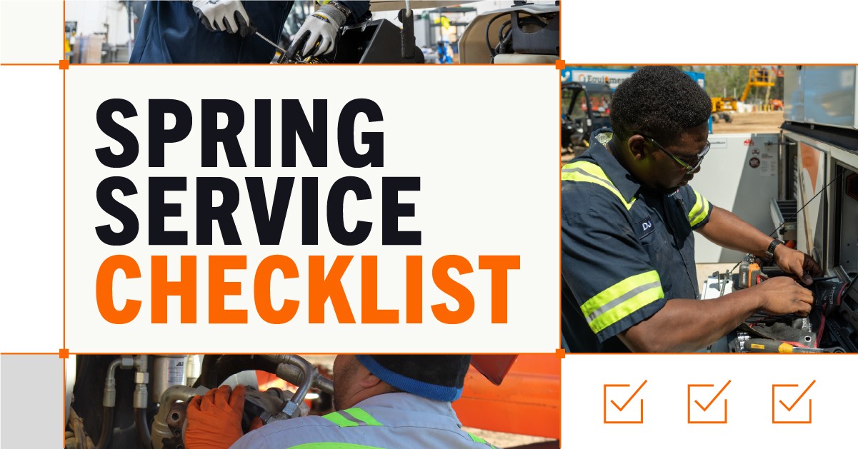 Mechanics working on construction equipment