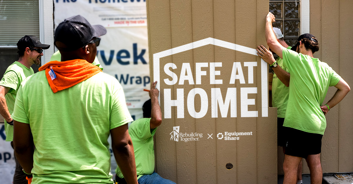 EquipmentShare volunteers install new siding on a house.