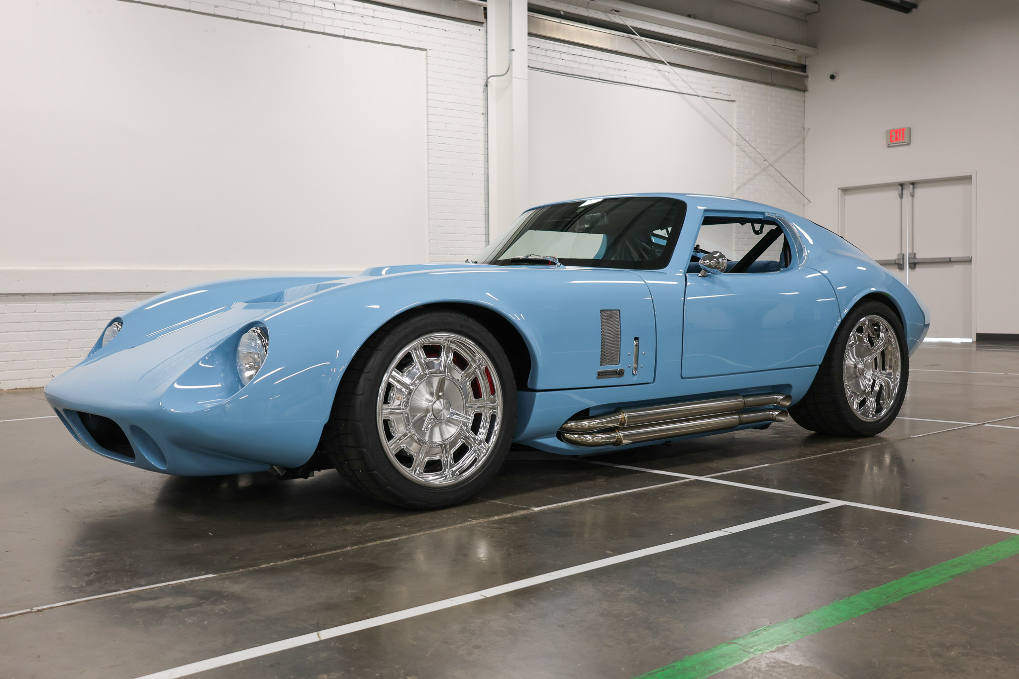 Young boy working on engine