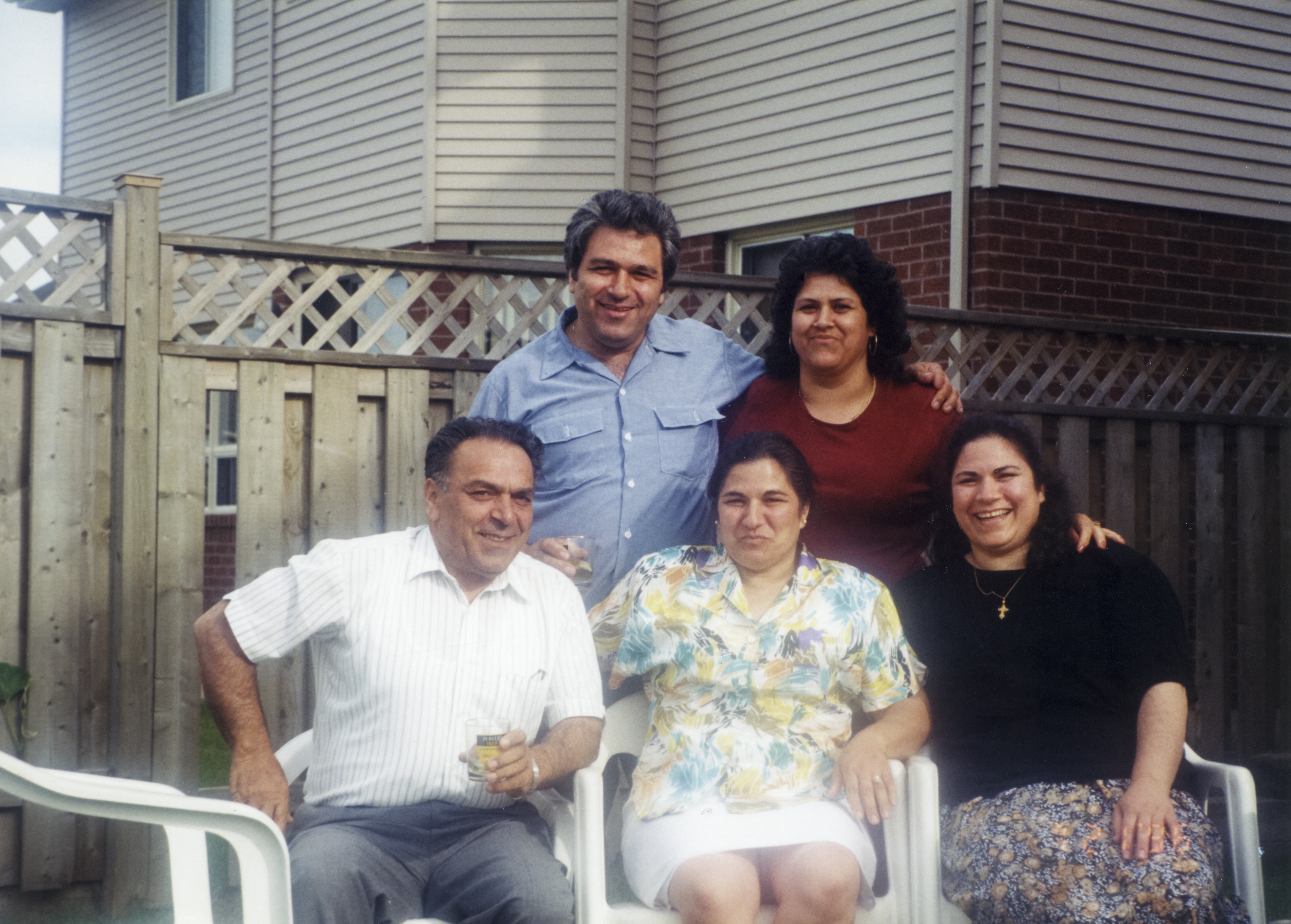 Helen's mother (seated in the coloured shirt) with her brothers and two of her sisters, July 21, 1996