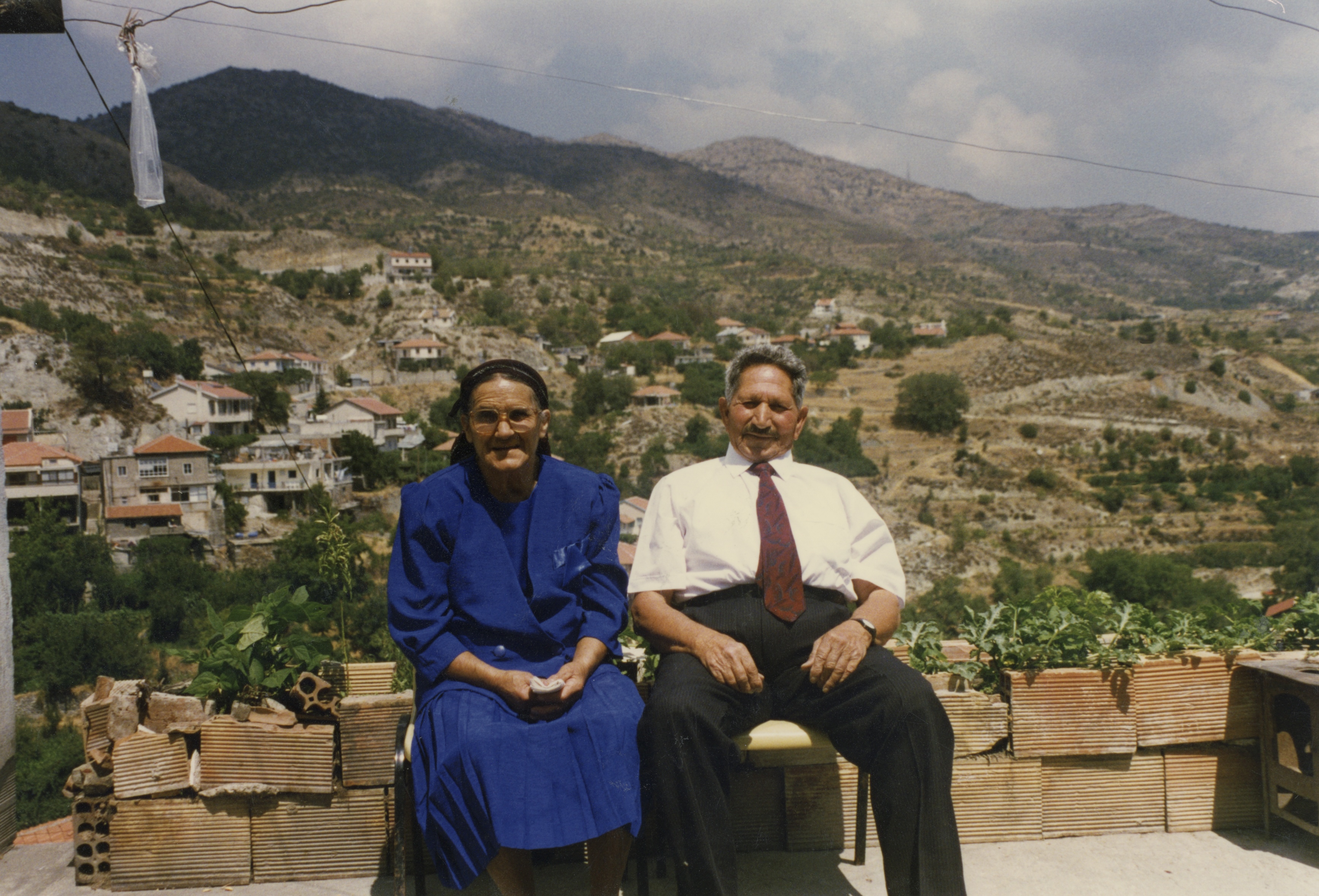 Helen's yiayia and pappou outside their home in Kyperounda, 1998