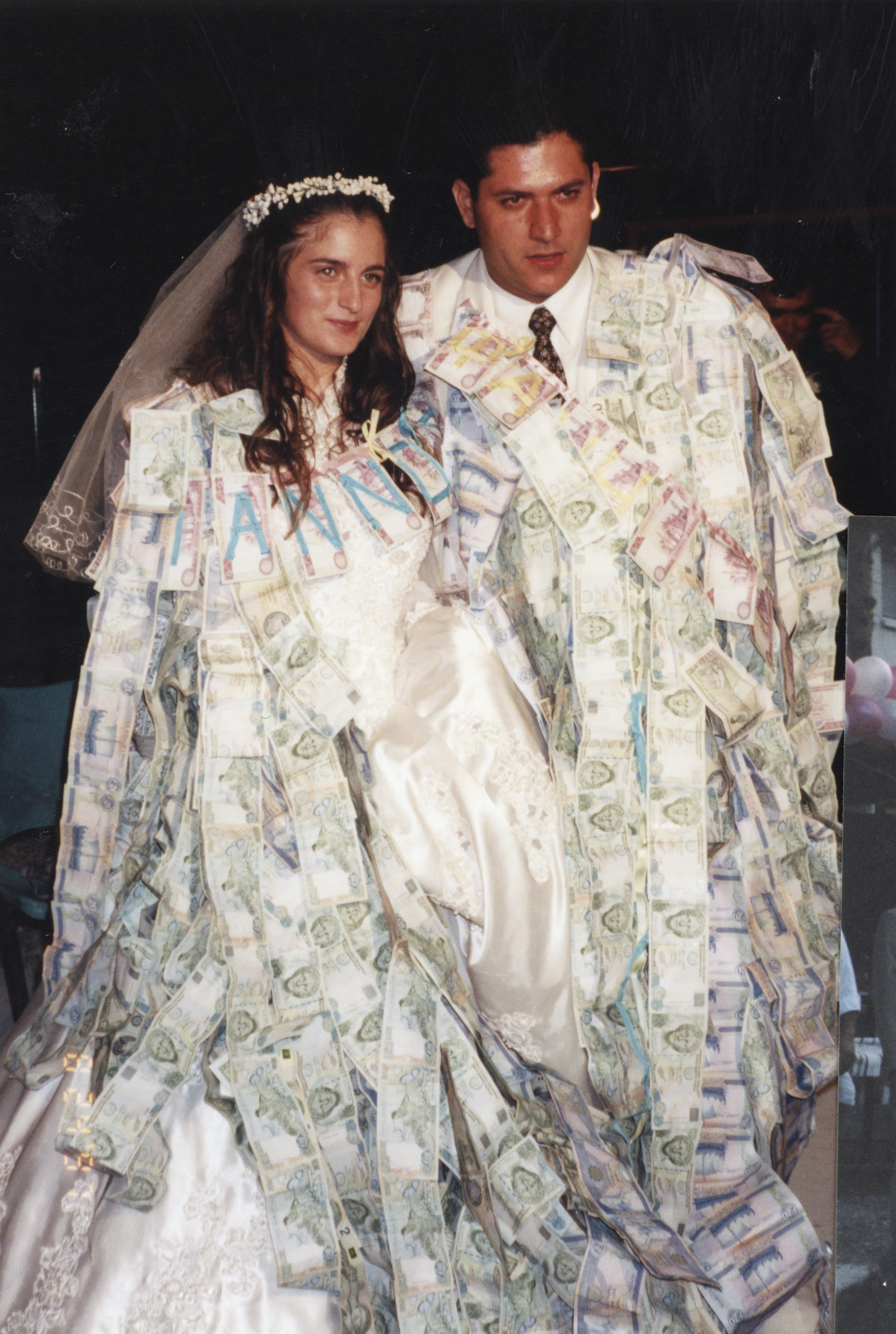 Helen's cousin and wife adorned with money at their wedding, August 23, 1997