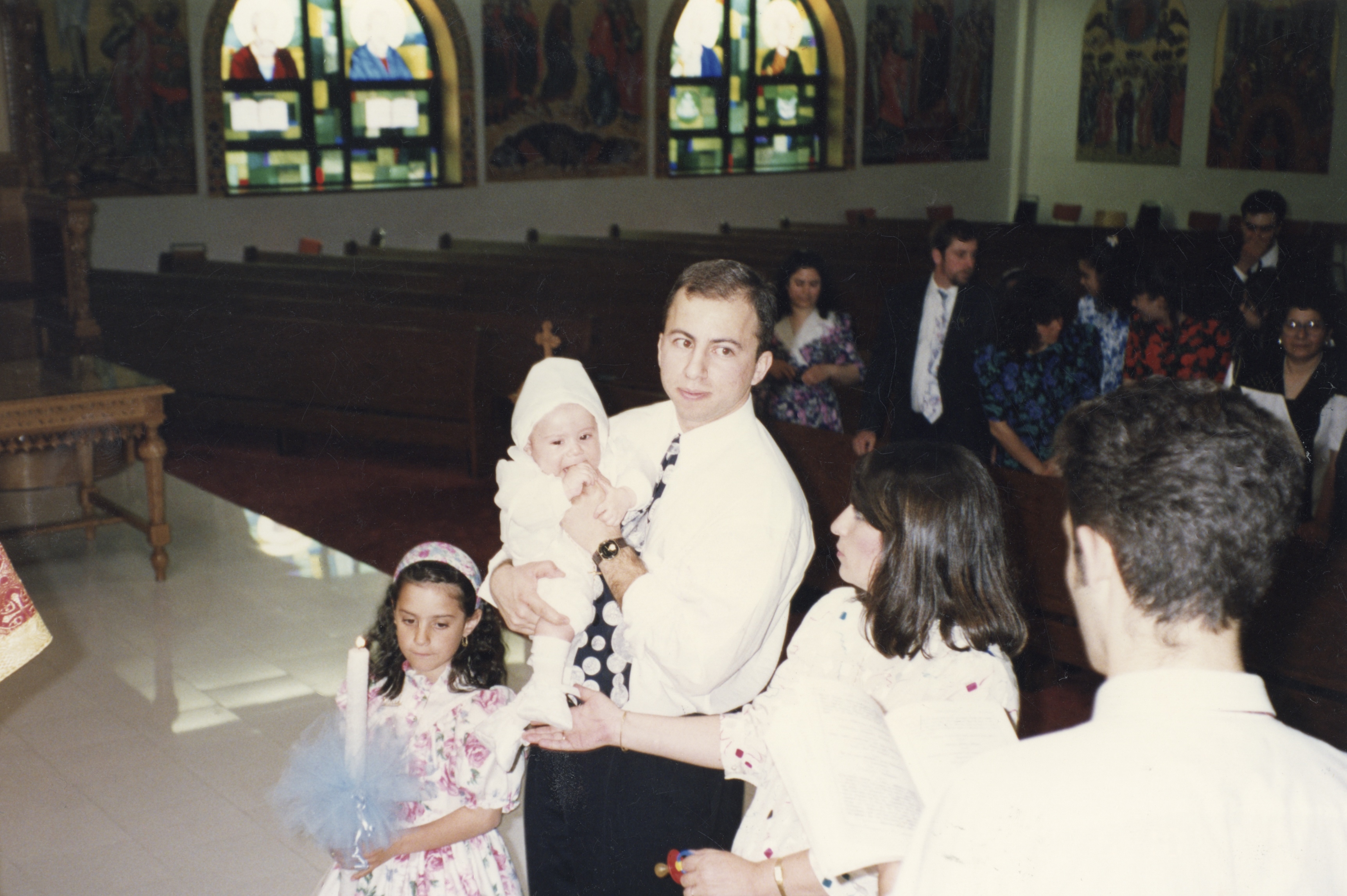 George's son, Alex, baptizing the interviewer at St. John the Baptist Greek Orthodox Church, May 1992