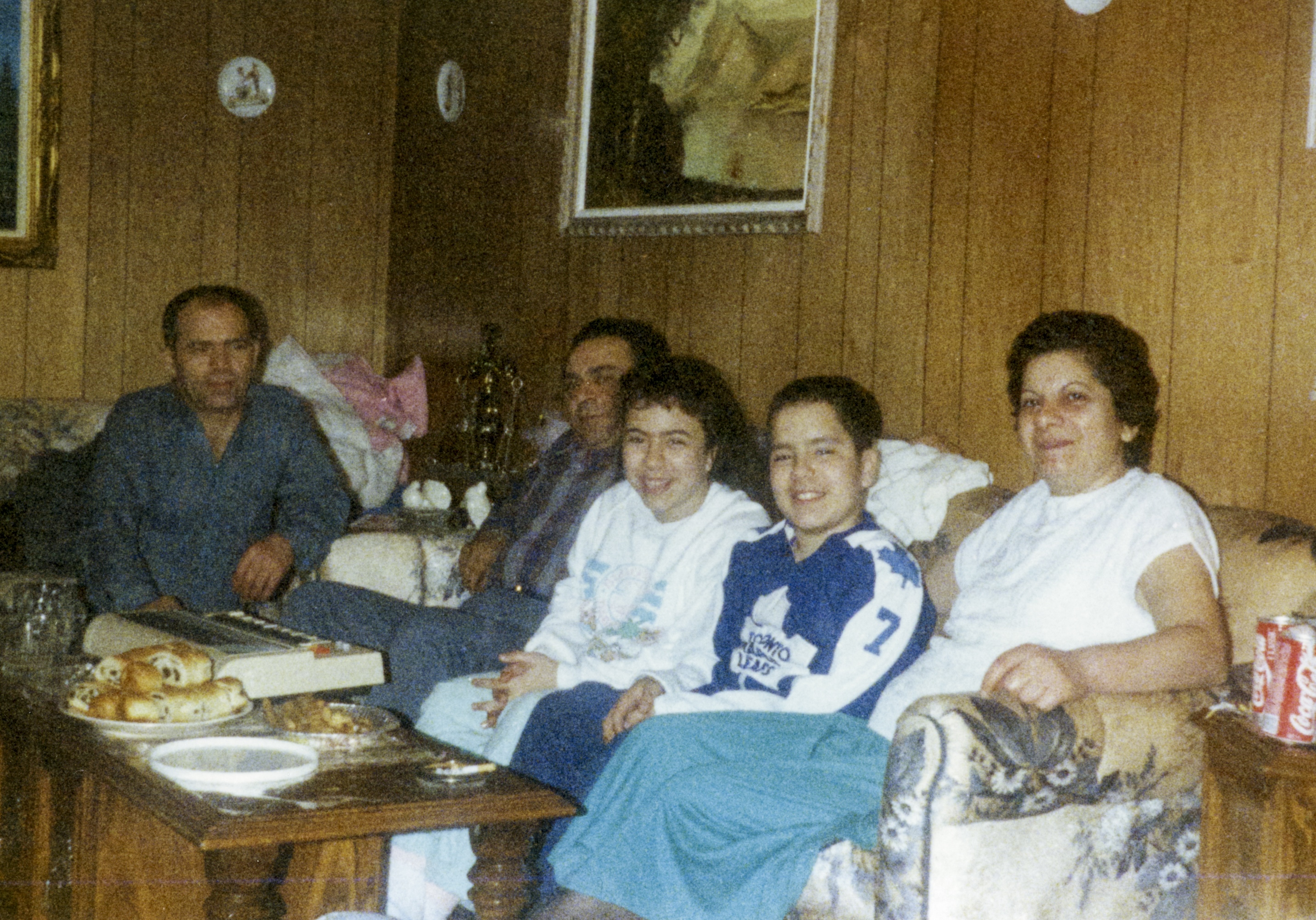 Anna celebrating her birthday with her father, brother, aunt, and uncle (fellow interviewee, Theodoros Xenophontos), 1989 