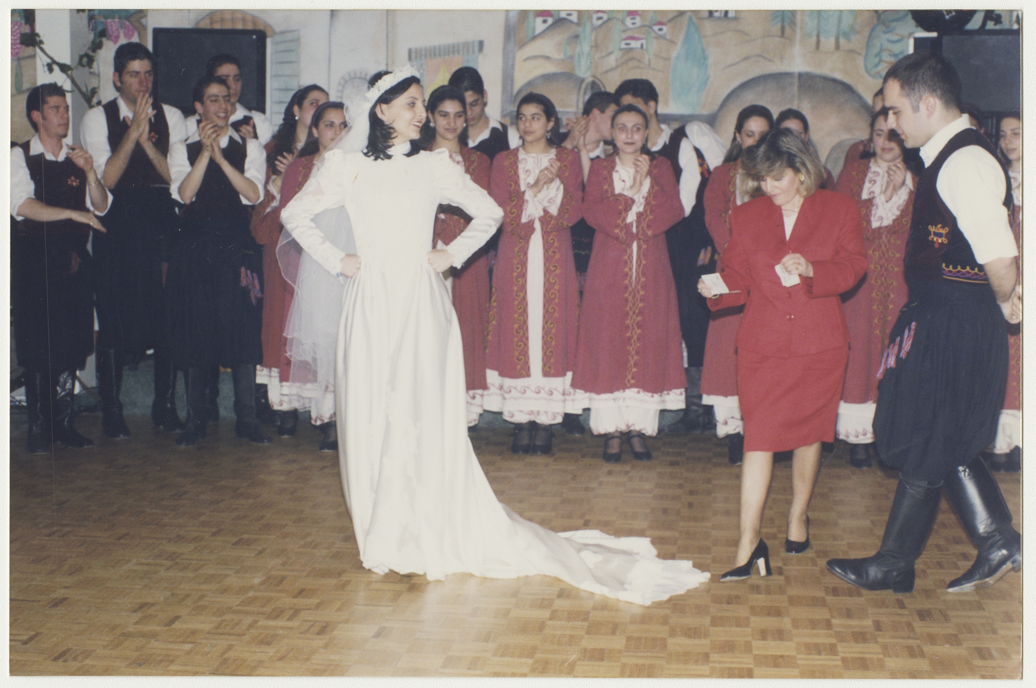 Anna's brother (with Anna in the background) with the Cypriot dance group, late 1990s. York University Libraries, ASC61635