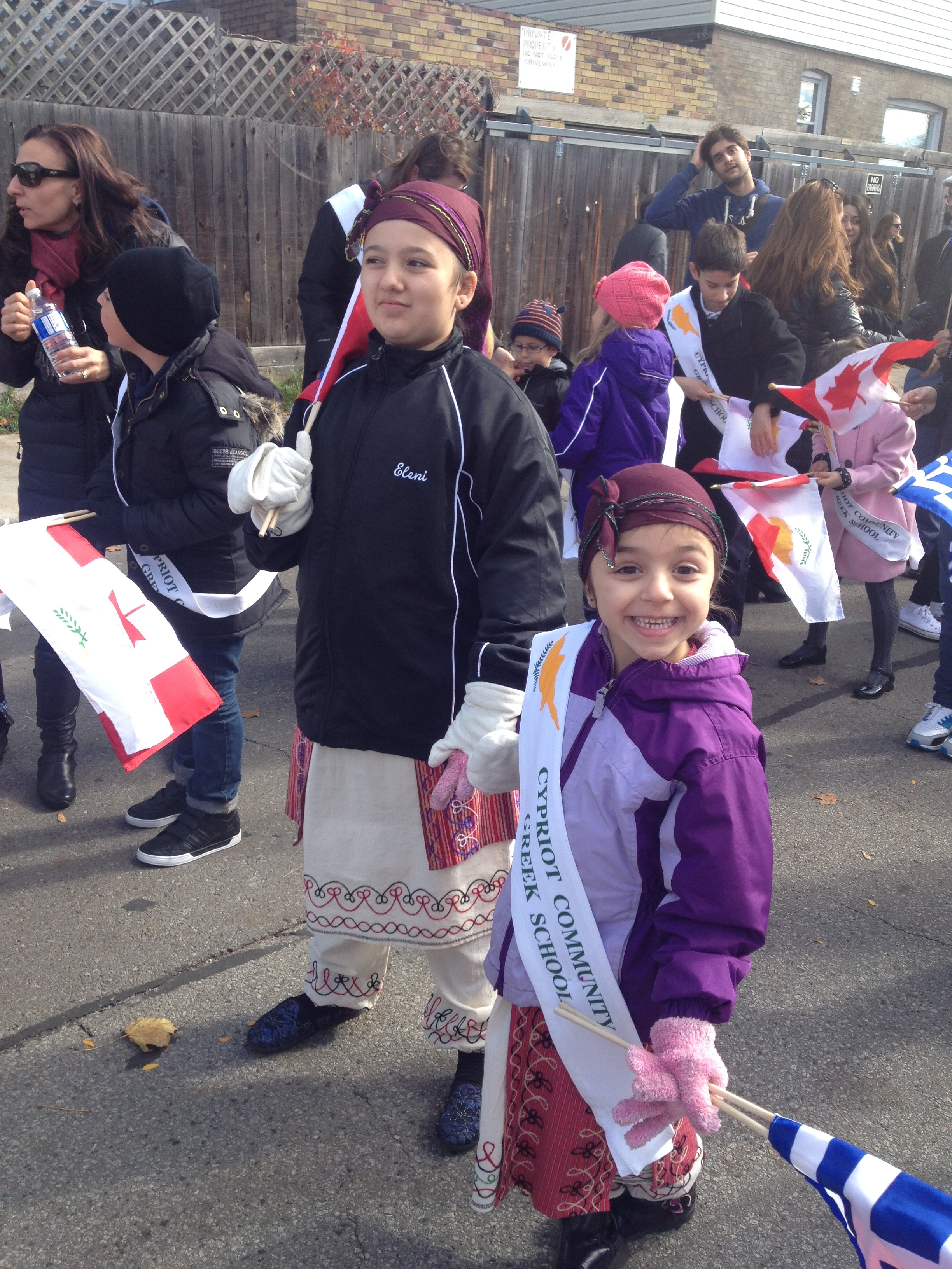 Anna's daughters representing the Cypriot Community Greek School at the Oxi Day parade, 2015