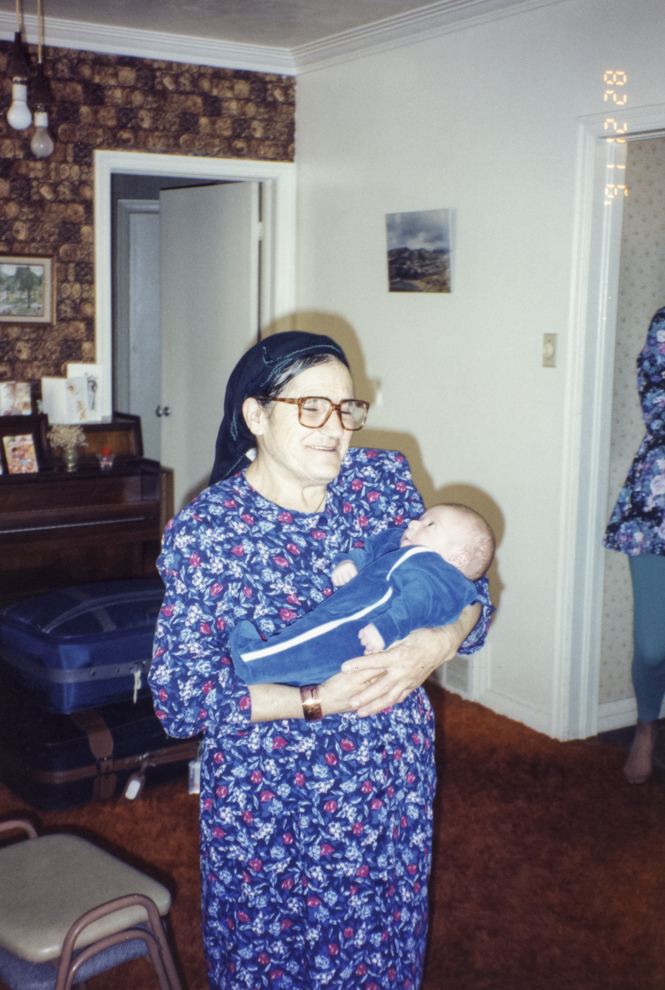 Theodoros' mother holding the interviewer, December 28, 1991
