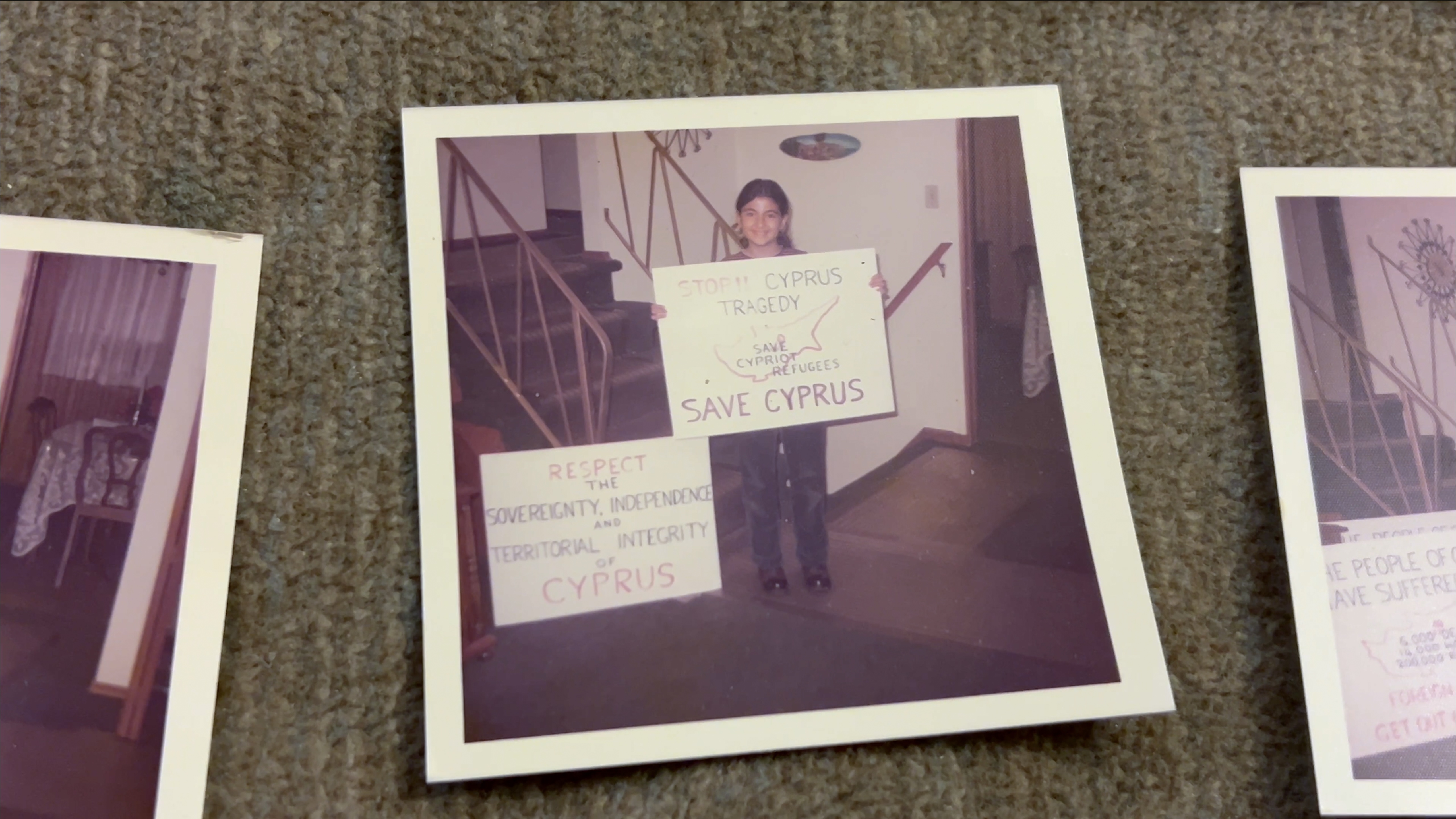 One of Androula's daughters holding a sign made by her parents, getting ready to go to Ottawa to the protest the Turkish invasion, 1974 
