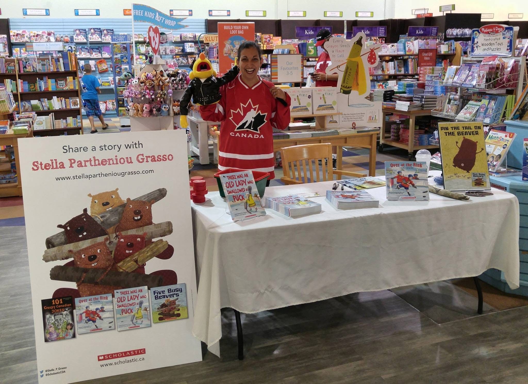 Stella with a display of her books (2015)
