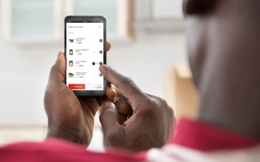 Man clicking on Mobile phone App