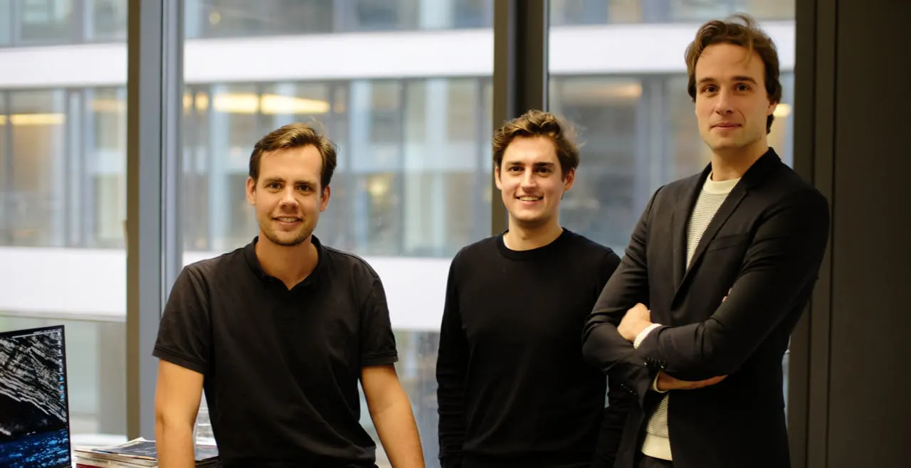 Three man looking at camera