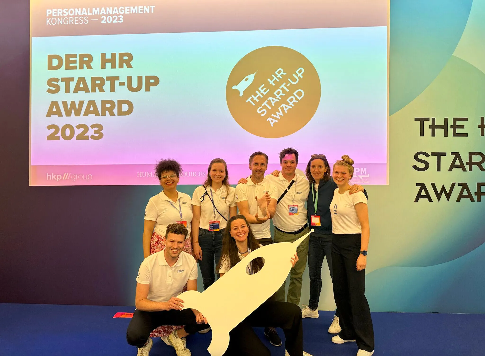 Team of whatever.works holding startup award